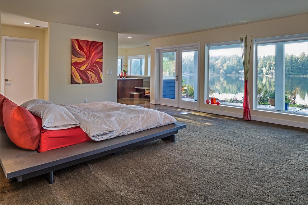 Photo of a large contemporary master bedroom in Seattle with beige walls, carpet, no fireplace and grey floor.
