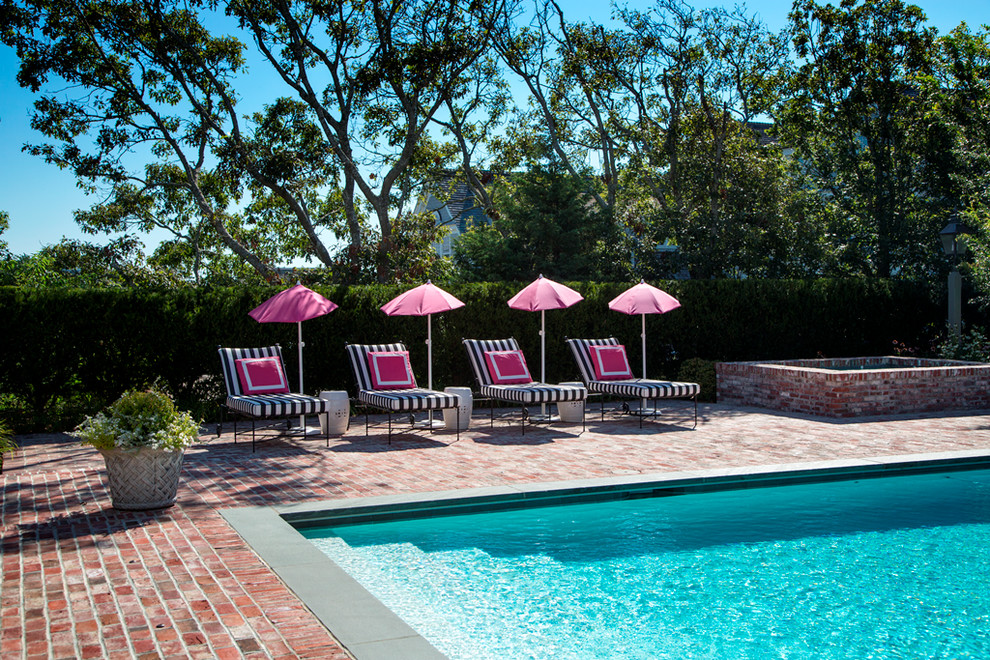 Mid-sized beach style side yard rectangular pool in Boston with a hot tub and brick pavers.