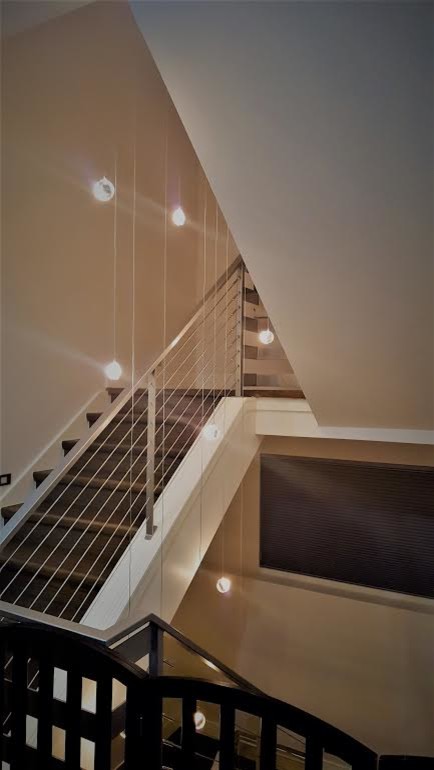Inspiration for a large transitional u-shaped staircase remodel in Denver