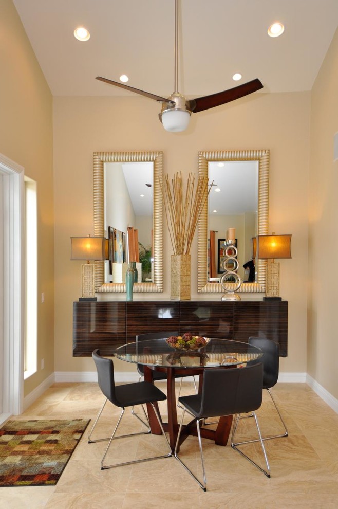 Photo of a small contemporary separate dining room in San Diego with beige walls, travertine floors and no fireplace.