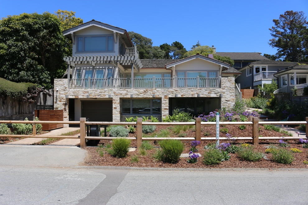 Photo of a mid-sized contemporary two-storey beige exterior in San Francisco with stone veneer and a gable roof.