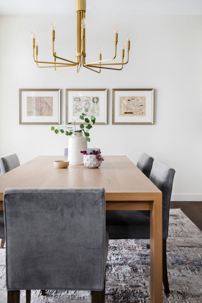 Kitchen/dining room combo - mid-sized transitional medium tone wood floor and brown floor kitchen/dining room combo idea in Calgary with white walls