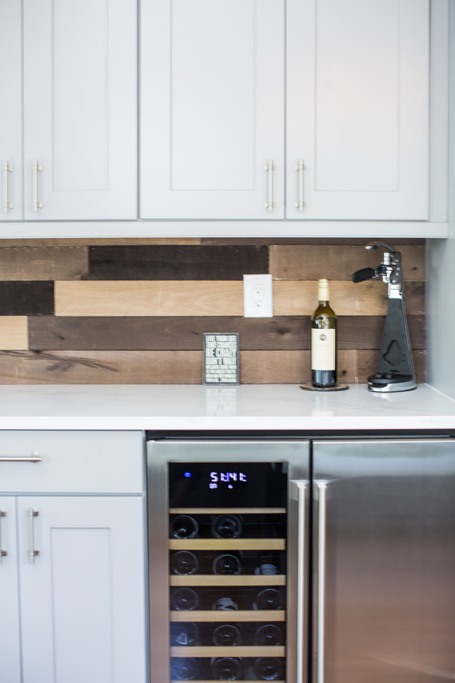 Example of a huge transitional u-shaped eat-in kitchen design in Denver with shaker cabinets, gray cabinets, quartz countertops, blue backsplash, no island and white countertops