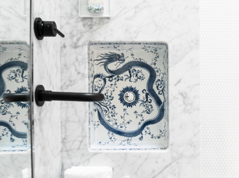 Example of a mid-sized transitional home design design with an undermount sink and marble countertops