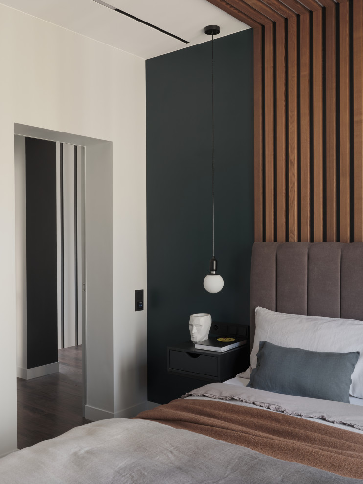 Photo of a medium sized contemporary master bedroom in Saint Petersburg with grey walls, porcelain flooring, brown floors, panelled walls and a feature wall.