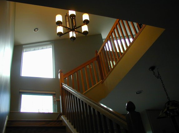 Example of a small classic straight staircase design in St Louis