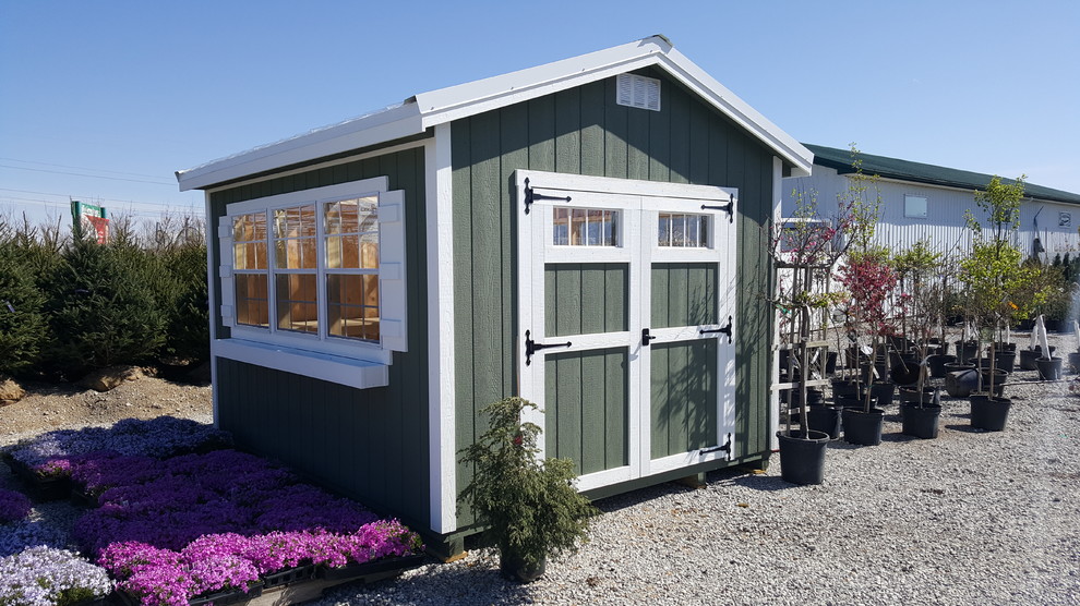 This is an example of a mid-sized transitional detached garden shed in Columbus.