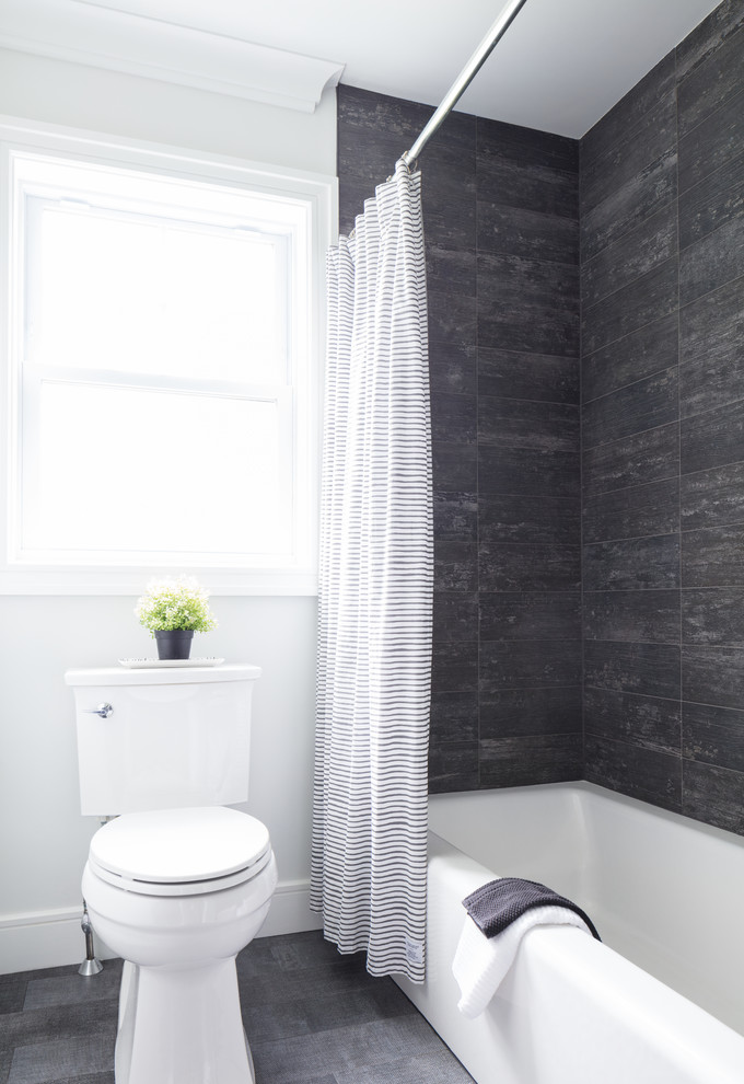 Inspiration for a small farmhouse 3/4 black tile and porcelain tile porcelain tile and black floor drop-in bathtub remodel in New York with a two-piece toilet, white walls and an undermount sink