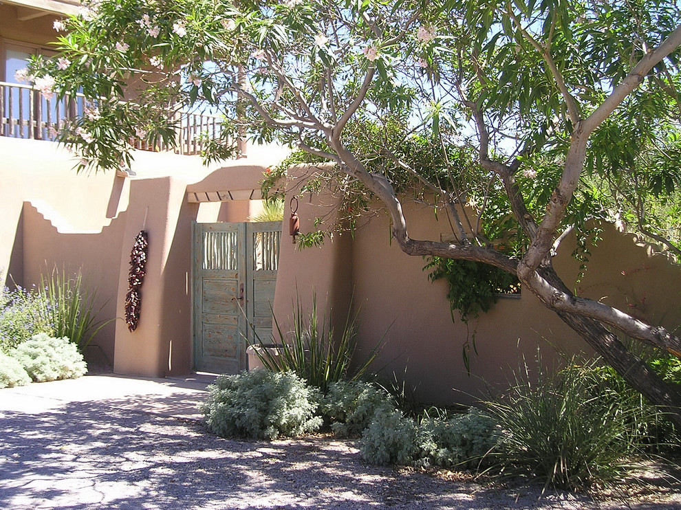 Photo of a large southwestern partial sun stone landscaping in Albuquerque.