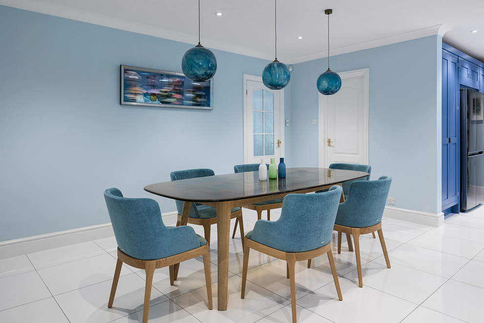 Inspiration for a mid-sized contemporary open plan dining in Hampshire with ceramic floors and white floor.