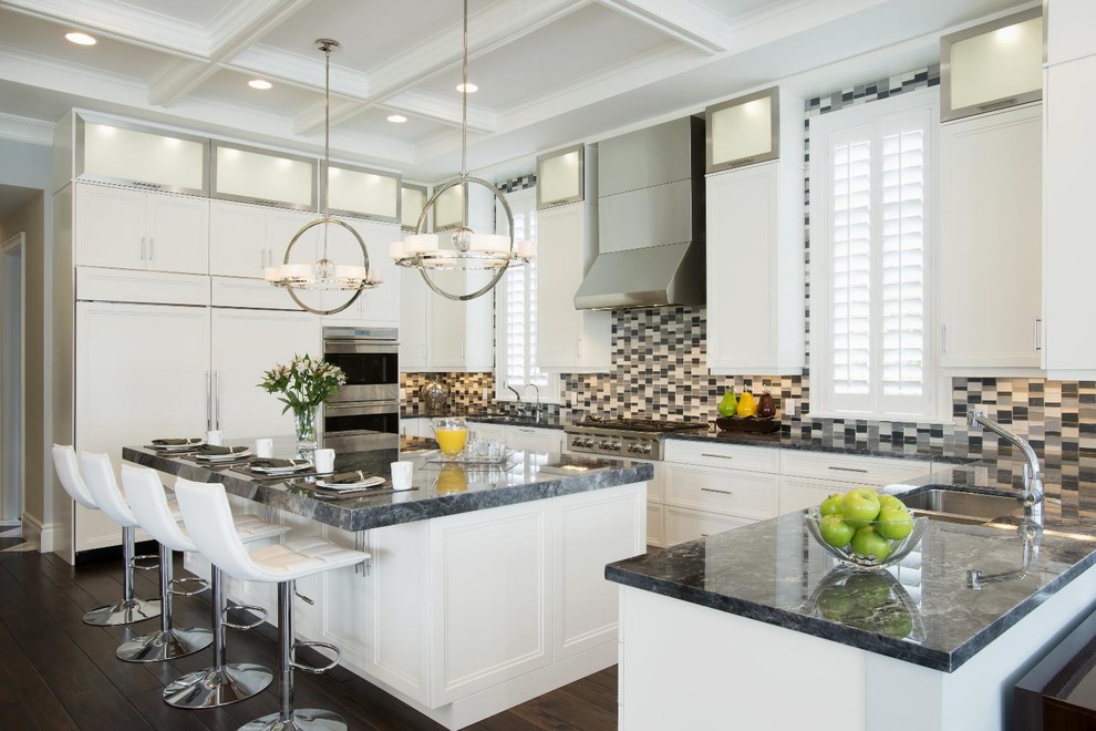 Large transitional dark wood floor eat-in kitchen photo with a double-bowl sink, flat-panel cabinets, white cabinets, gray backsplash, glass tile backsplash, stainless steel appliances and gray walls