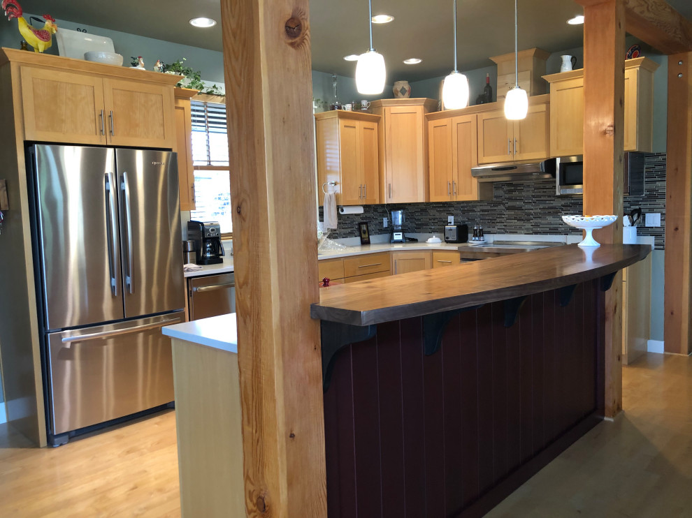 Open concept kitchen - mid-sized transitional l-shaped medium tone wood floor open concept kitchen idea with an undermount sink, flat-panel cabinets, light wood cabinets, quartz countertops, multicolored backsplash, ceramic backsplash, stainless steel appliances, an island and white countertops