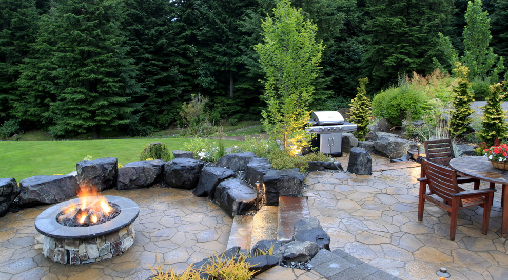 This is an example of an eclectic patio in Seattle.