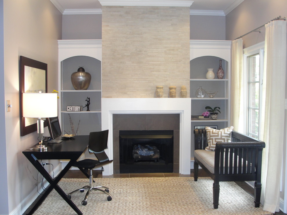 Inspiration for a contemporary home office in Chicago with grey walls, a freestanding desk and a standard fireplace.