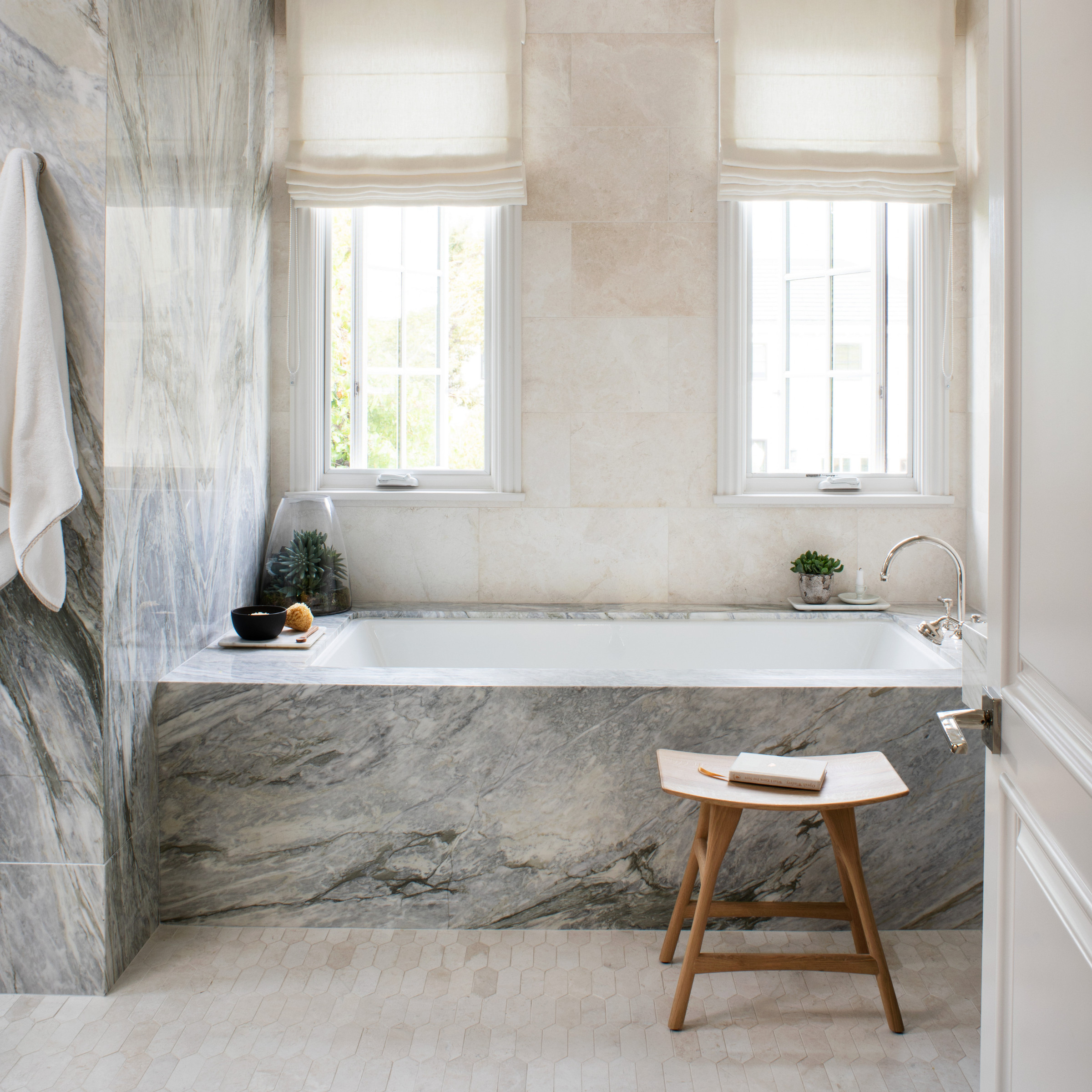 master-bathroom-calacatta-marble-bookmatched-shower - The Glam Pad