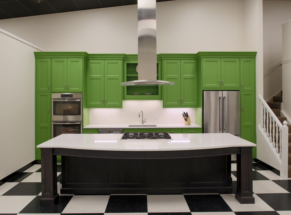 Mid-sized transitional galley open concept kitchen photo with an undermount sink, recessed-panel cabinets, green cabinets, quartz countertops, stainless steel appliances and an island