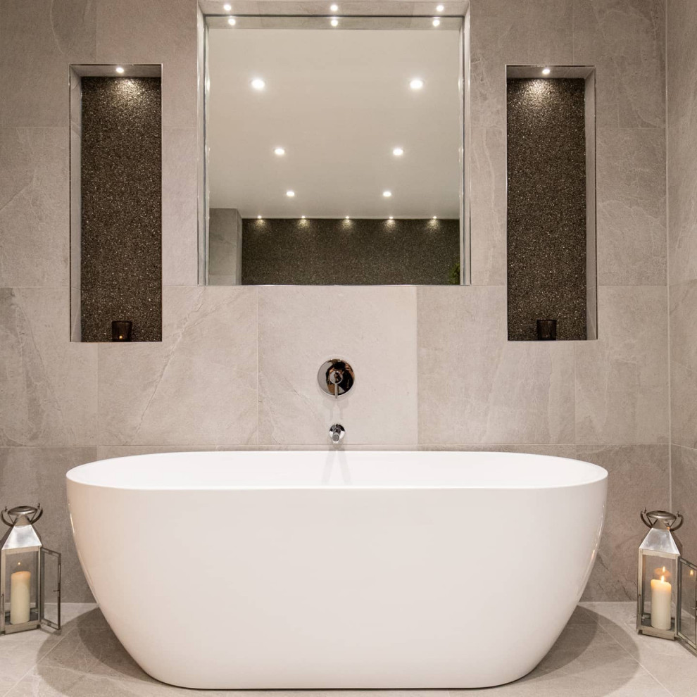 This is an example of a large contemporary family bathroom in Hertfordshire with flat-panel cabinets, white cabinets, a freestanding bath, a built-in shower, a wall mounted toilet, grey tiles, porcelain tiles, grey walls, porcelain flooring, a wall-mounted sink, grey floors, a sliding door, a wall niche, a single sink, a floating vanity unit, all types of ceiling and wallpapered walls.