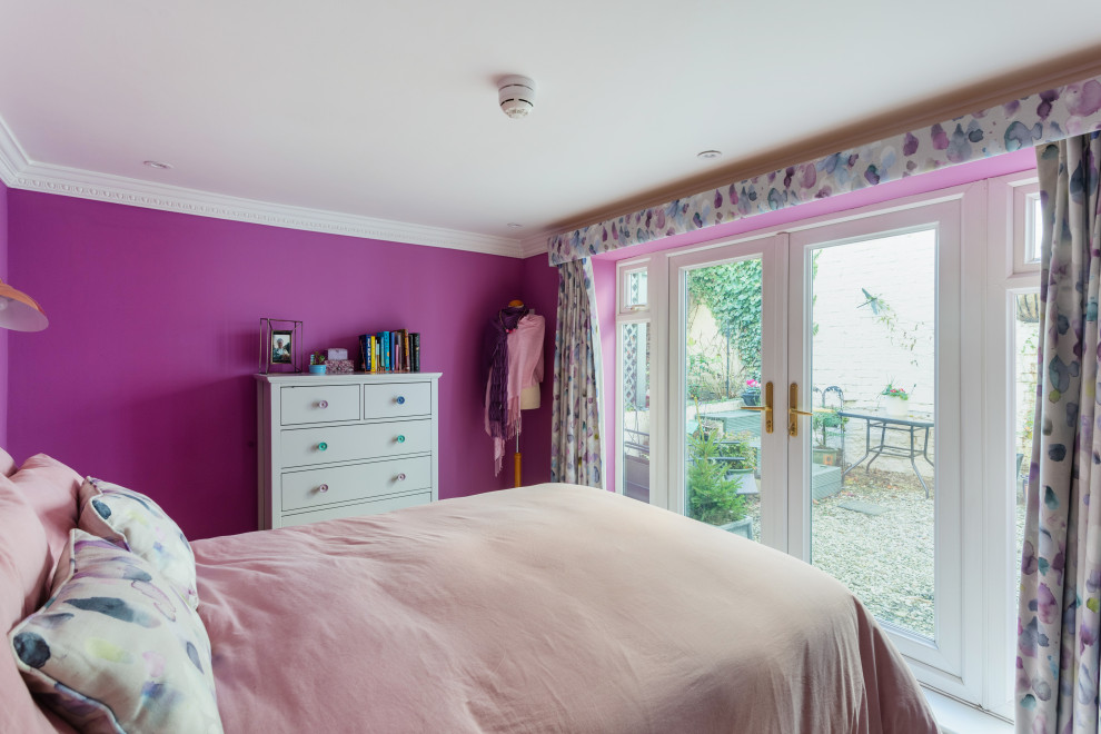 This is an example of a medium sized contemporary master bedroom in Gloucestershire with purple walls, carpet, no fireplace and beige floors.