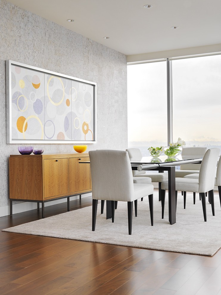 Photo of a contemporary dining room in Vancouver with grey walls and dark hardwood floors.