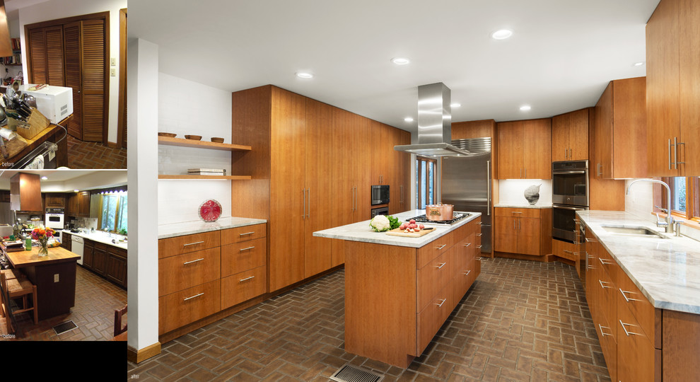 Photo of a large contemporary u-shaped eat-in kitchen in Other with an undermount sink, flat-panel cabinets, medium wood cabinets, marble benchtops, white splashback, porcelain splashback, stainless steel appliances, terra-cotta floors, with island and brown floor.