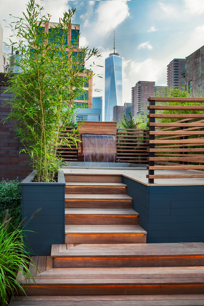 Design ideas for a contemporary rooftop and rooftop deck in New York with a water feature and no cover.
