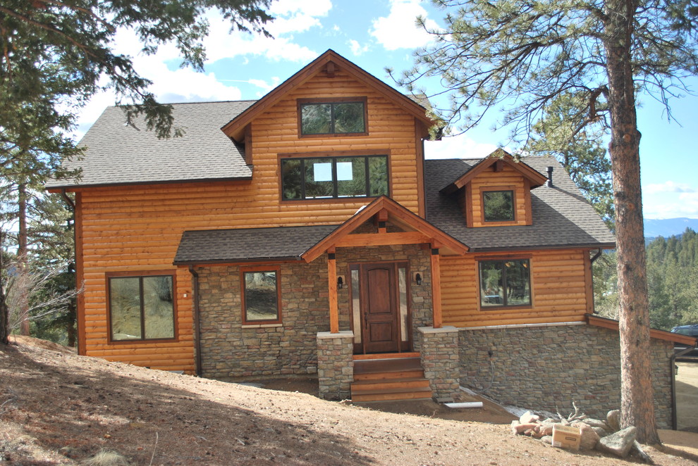 Inspiration for an arts and crafts three-storey brown exterior in Denver with wood siding.