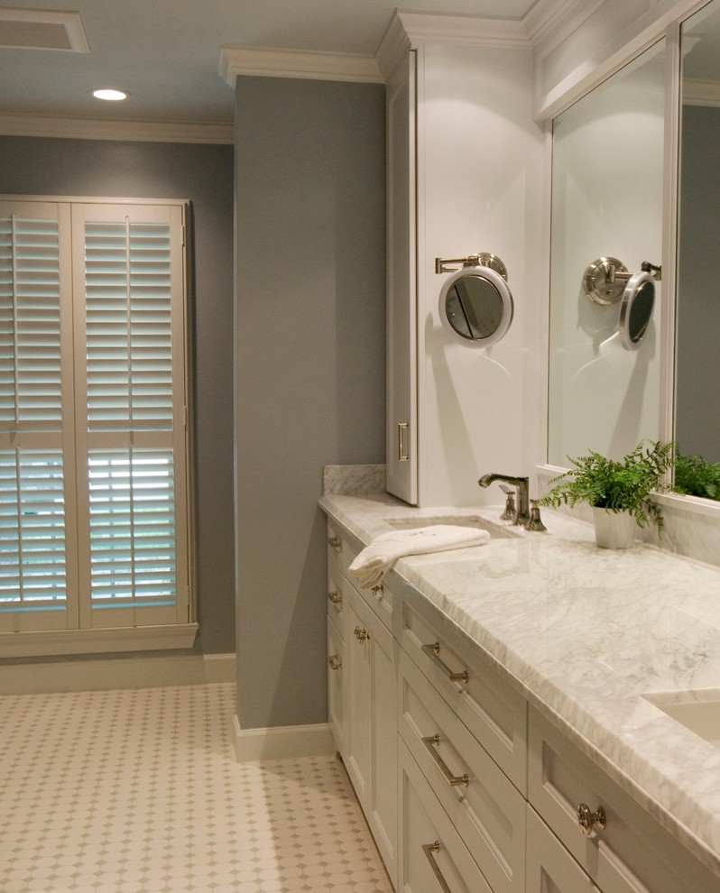 Inspiration for a mid-sized transitional master ceramic tile and white tile ceramic tile and white floor bathroom remodel in Houston with an undermount sink, white cabinets, gray walls, beaded inset cabinets, marble countertops and white countertops