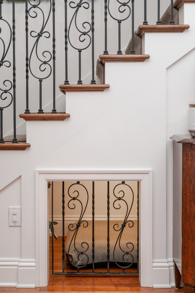 Design ideas for a large eclectic wood straight staircase in Tampa with wood risers and metal railing.