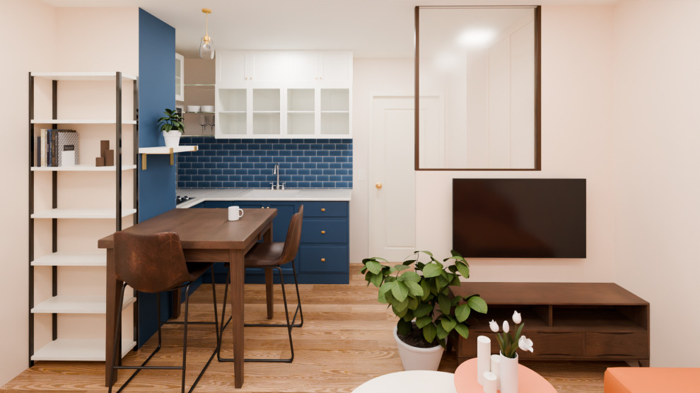 Espace de vie compact : cuisine, repas et salon réunis dans un studio