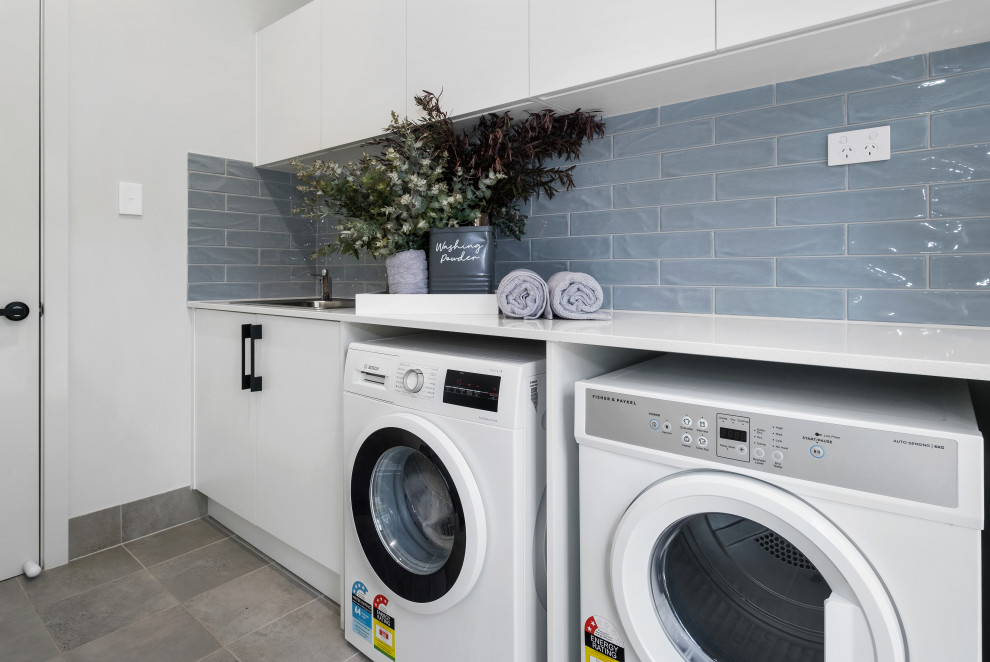 Photo of a beach style laundry room in Wollongong.