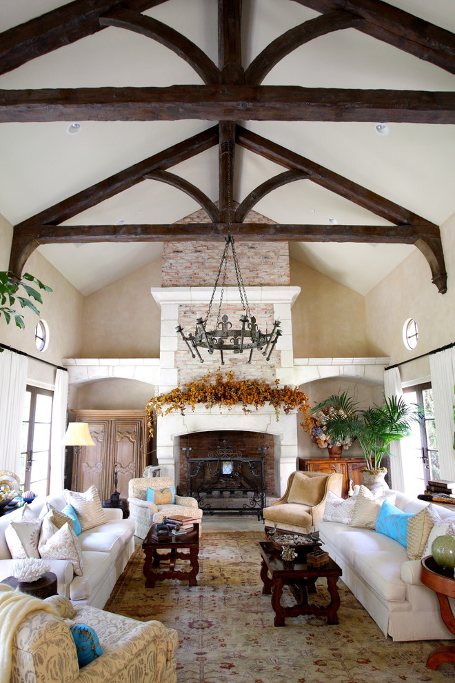 Photo of a large mediterranean living room in Dallas with beige walls.