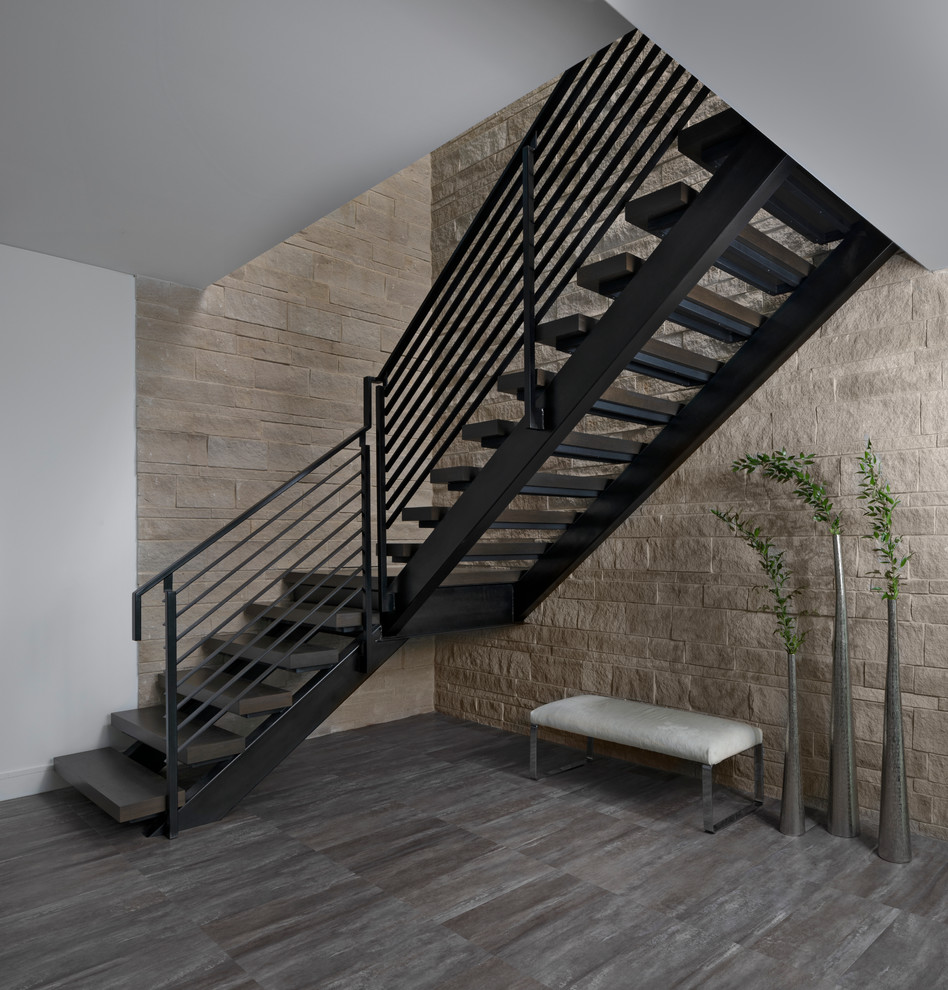 Contemporary wood l-shaped staircase in Detroit with open risers and cable railing.