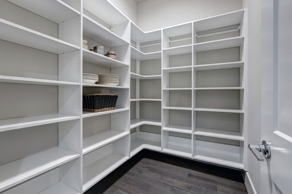 Inspiration for a large contemporary walk-in wardrobe in Toronto with open cabinets, medium wood cabinets, bamboo floors and grey floor.