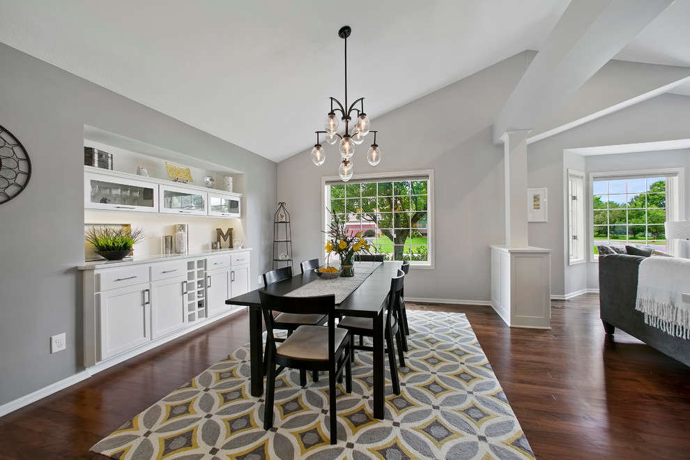 Photo of a transitional open plan dining in Minneapolis with grey walls and medium hardwood floors.
