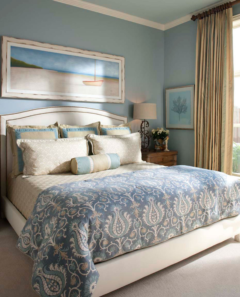 This is an example of a mid-sized traditional guest bedroom in Other with blue walls and carpet.