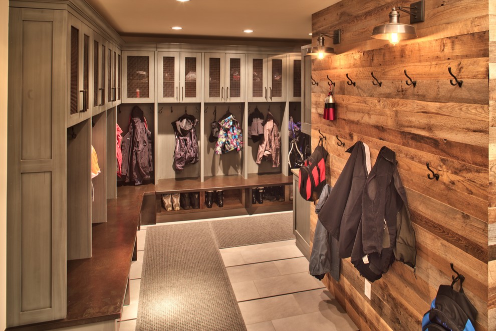 This is an example of a country mudroom in Denver with grey floor.