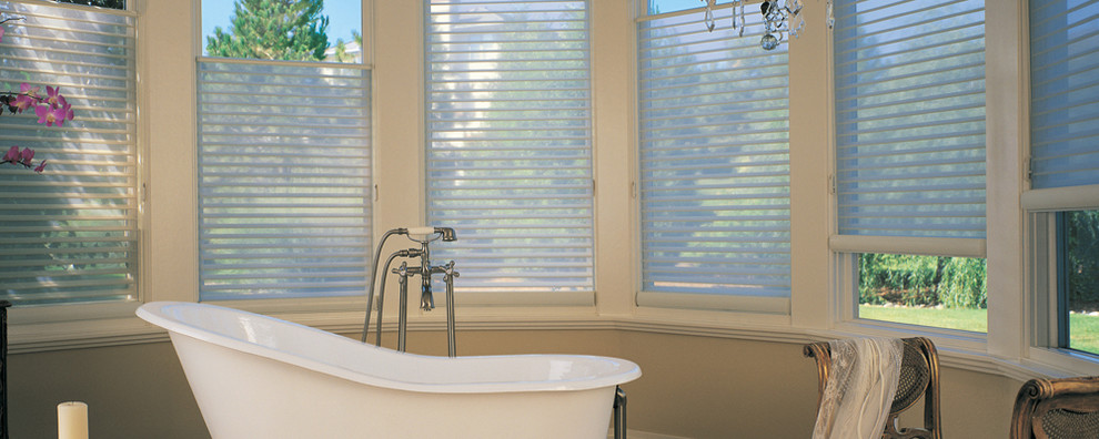 Inspiration for a large transitional master freestanding bathtub remodel with open cabinets, white cabinets, a console sink, solid surface countertops and beige walls