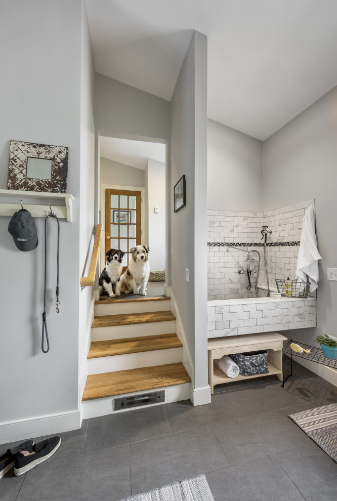 Design ideas for a large traditional mudroom in Providence with grey walls, slate floors, grey floor and vaulted.