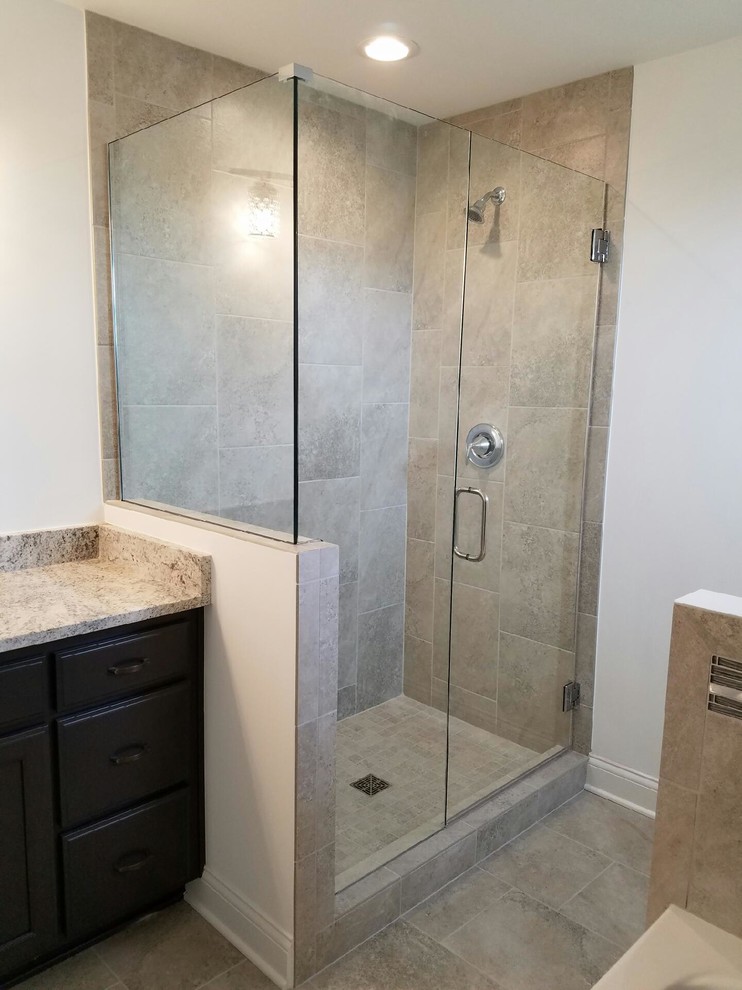 Small traditional master bathroom in Chicago with dark wood cabinets, an alcove tub, a corner shower, beige tile, ceramic tile, white walls, ceramic floors, granite benchtops, beige floor, a hinged shower door and beige benchtops.