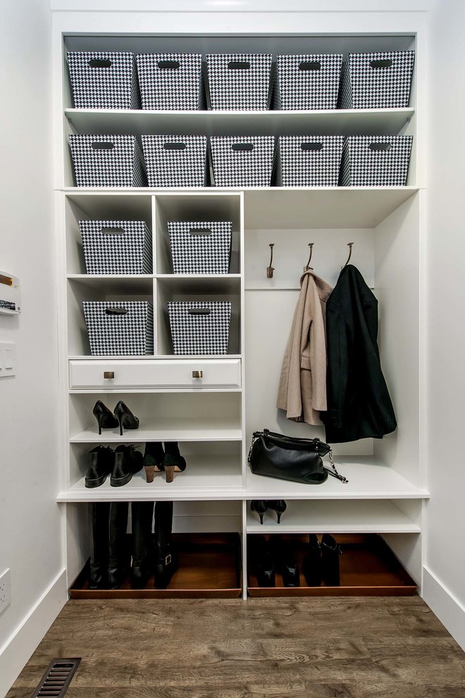 Inspiration for a transitional mudroom in Other with white walls and dark hardwood floors.