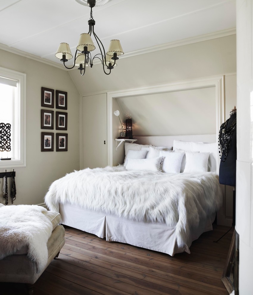This is an example of a mid-sized traditional master bedroom in Stockholm with grey walls, dark hardwood floors and no fireplace.
