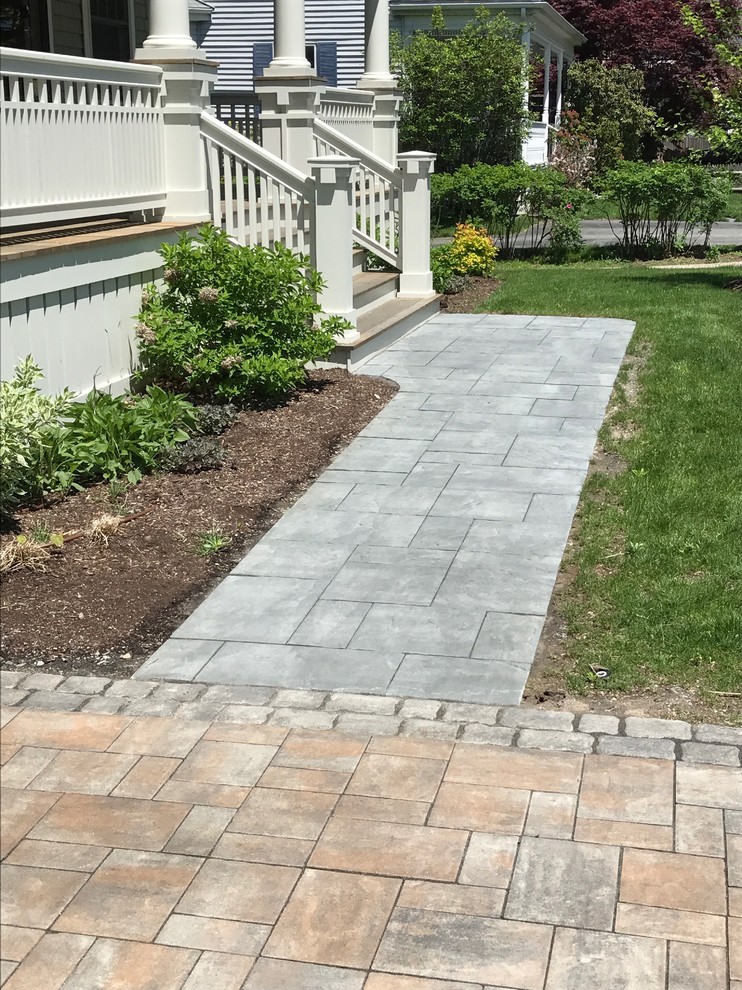 Inspiration for a mid-sized country front yard full sun driveway in Boston with concrete pavers and with path.