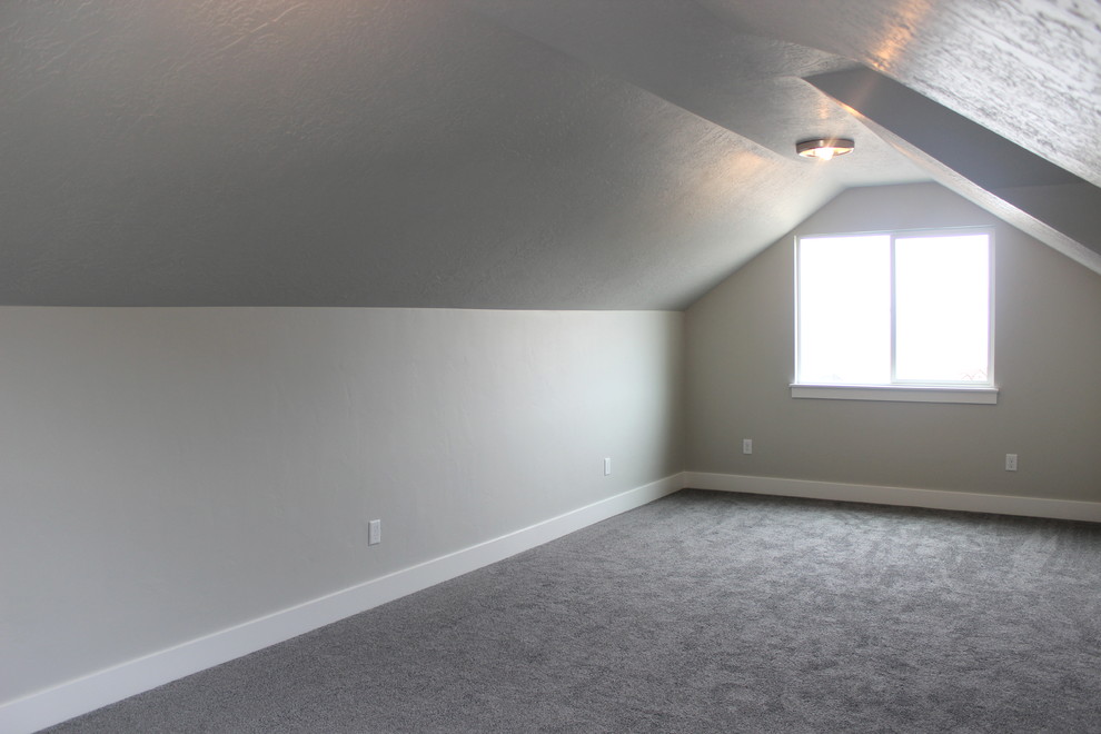Photo of a large arts and crafts enclosed family room in Salt Lake City with grey walls, a wall-mounted tv and carpet.