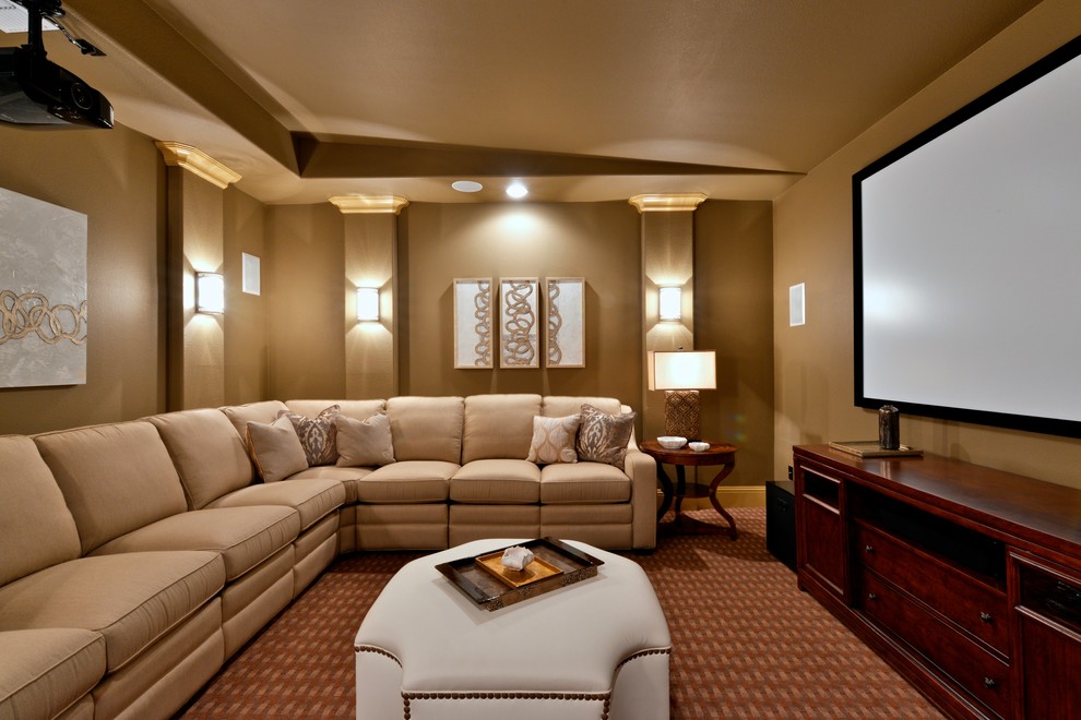 Photo of a large traditional enclosed home theatre in Dallas with carpet, a projector screen, red floor and brown walls.