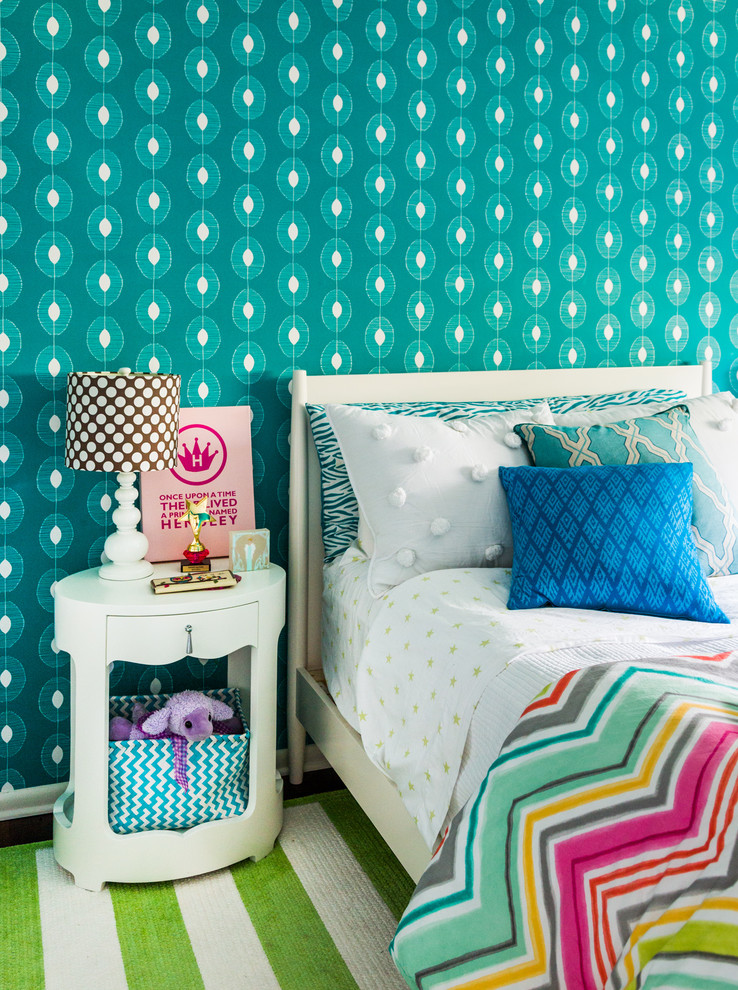 Photo of a beach style kids' bedroom for girls in Jacksonville with blue walls.