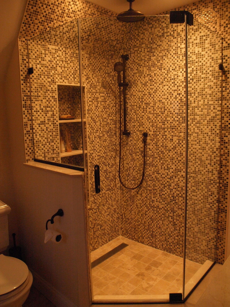 This is an example of a mid-sized mediterranean master bathroom in Newark with flat-panel cabinets, medium wood cabinets, a corner shower, a two-piece toilet, multi-coloured tile, mosaic tile, beige walls, ceramic floors, an undermount sink, engineered quartz benchtops, beige floor and a hinged shower door.