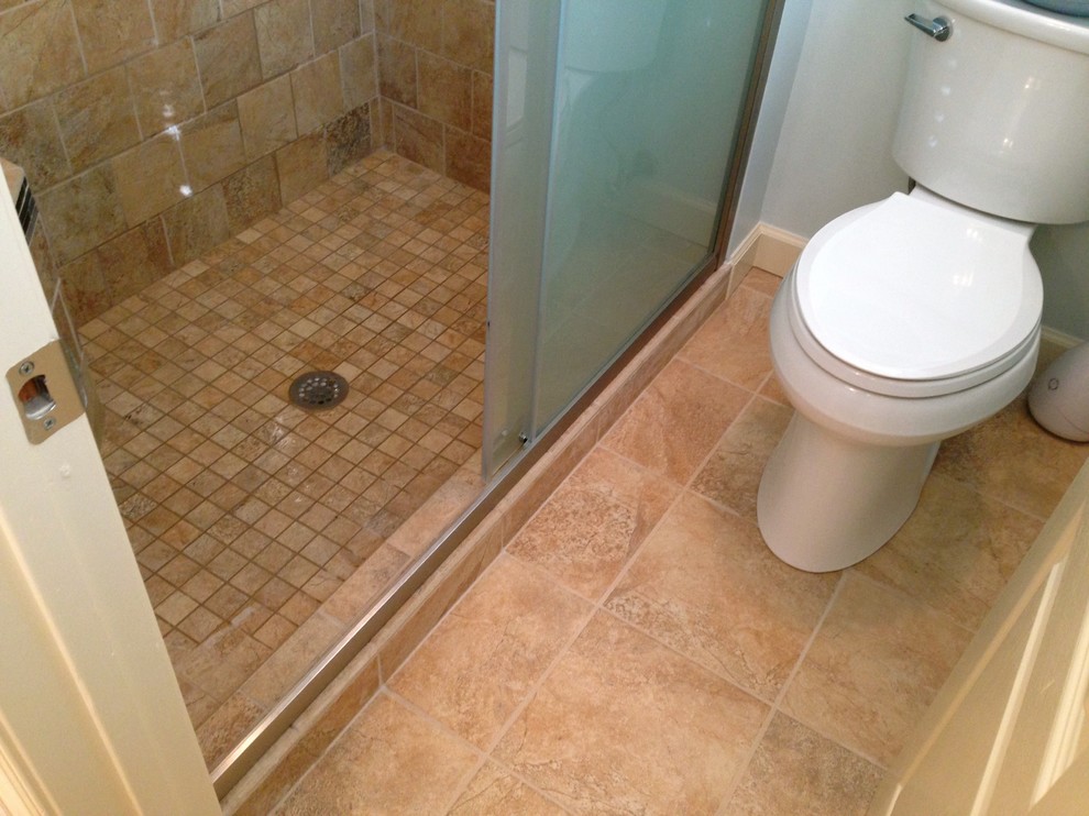 Mid-sized transitional master beige tile and porcelain tile porcelain tile alcove shower photo with raised-panel cabinets, white cabinets, a two-piece toilet and blue walls