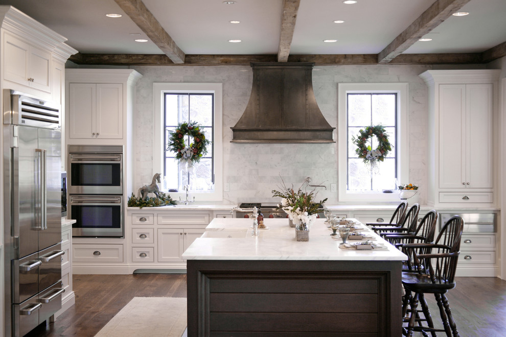 Design ideas for a traditional kitchen in Atlanta with white cabinets, stainless steel appliances and beaded inset cabinets.