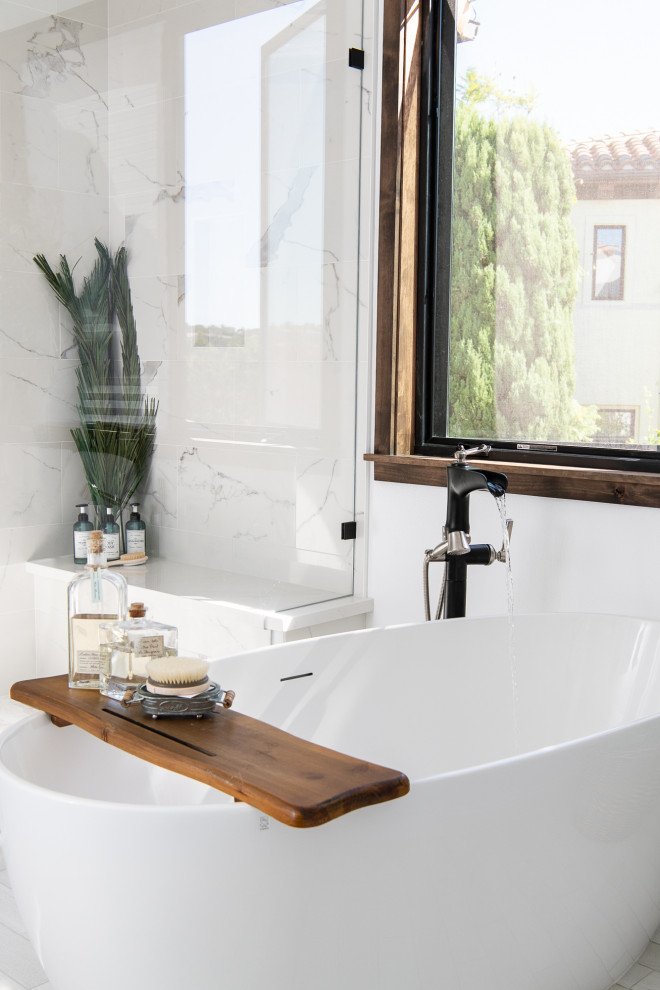 Inspiration for a mediterranean master bathroom in Orange County with a freestanding tub, a corner shower, a bidet, white walls, porcelain floors, an undermount sink, quartzite benchtops, white floor, a hinged shower door, white benchtops, a shower seat, a double vanity and a built-in vanity.