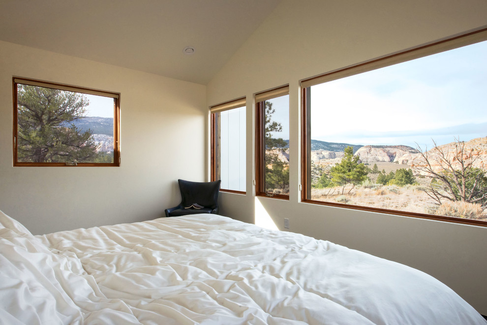 Design ideas for a small contemporary master bedroom in Salt Lake City with concrete floors.